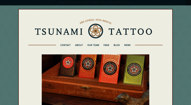 tsunamitattoo.com